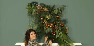 Dobbies’ stylist Rebecca Stanton with a festive floral tapestry