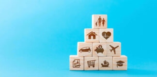 Wooden blocks with icons of various types of insurance.