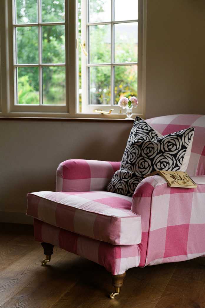 Tory Murphy’s Rose Collection cushion and Woodhouse Check Cotton Fabric Radish armchair