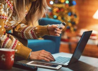 Woman doing online shopping at Christmas with her credit card