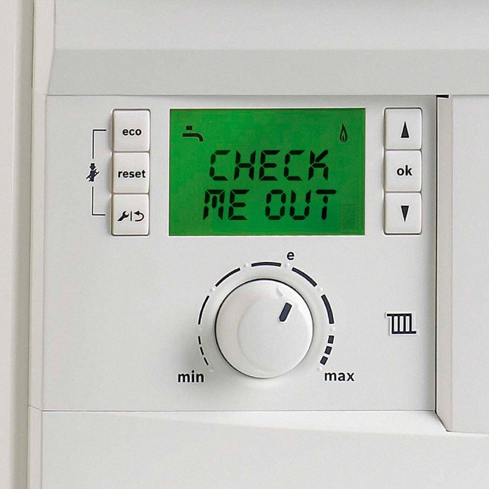 A thermostat reads 'check me out'