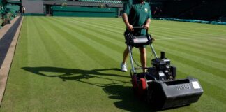 A man mowing the grass at Wimbledon