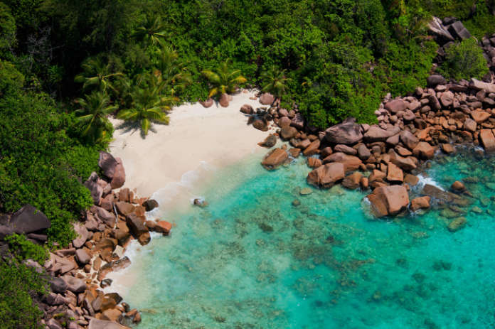 erial view of a secluded beach, coast of Praslin.Seychelles