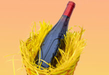 Bottle of red wine in an Easter basket