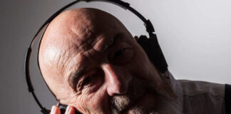 older man listening to music