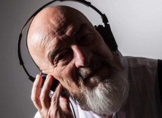 older man listening to music