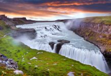 Panoramic view on Gullfoss waterfall on the Hvíta river, a popular tourist attraction and part of the Golden Circle Tourist Route in Southwest Iceland. Golden Waterfall.